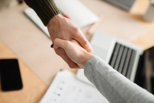 Employee shaking hands with a client